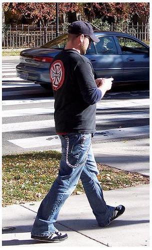 Man walking and texting