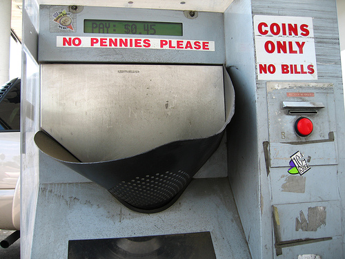 Toll booth with a no pennies please label