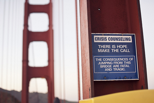 Golden gate with crisis counselling sign
