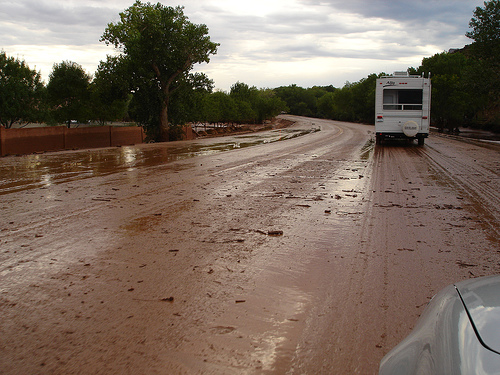RV driving on muddy highway